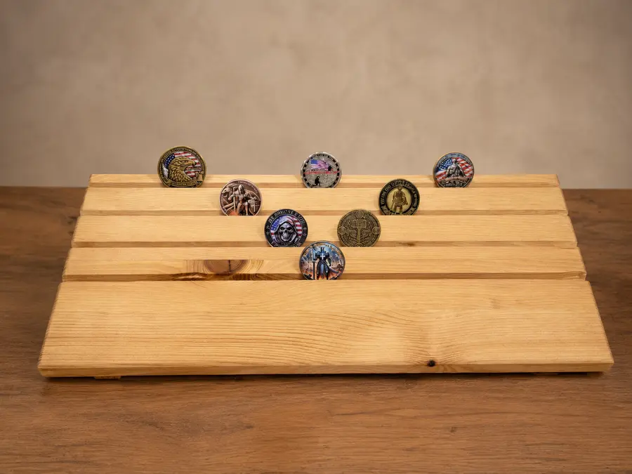 Wide view of a stained challenge coin holder prototype with an alternate sample-coin arrangement