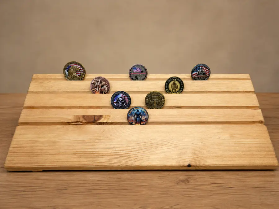 Front view of a stained pine challenge coin holder prototype displaying eight sample coins